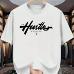 "The Hustles Houston" Brush Script Typography Oversized White T-Shirt